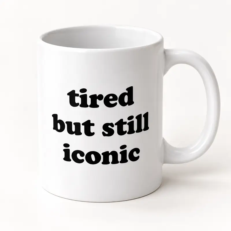 The white 11 oz ceramic mug with bold black lettering: tired but still iconic